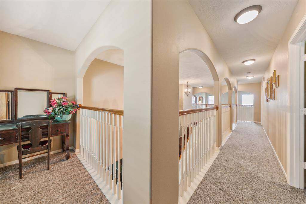 A landing outside of the second guest room offers many possibilities, perhaps a comfy reading or study area.