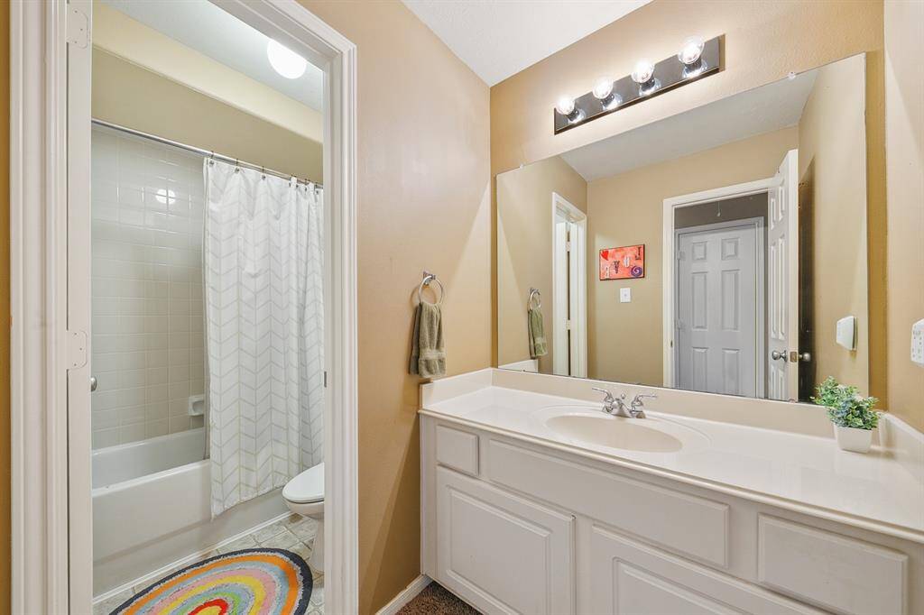 Guest bath off the game room and also services the third upstairs bedroom.