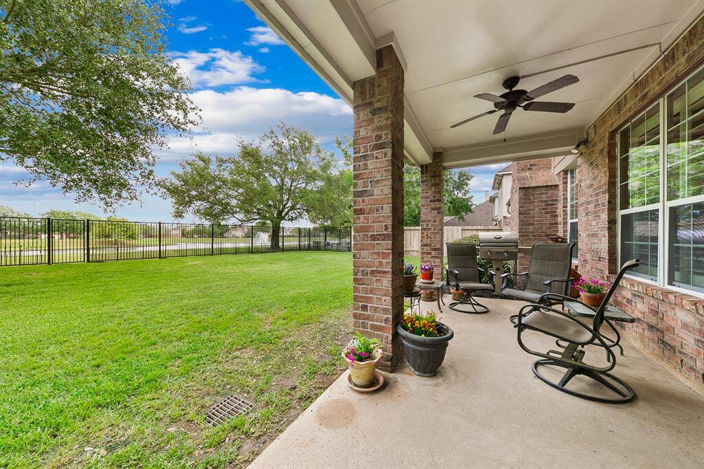 Covered back porch provides a comfortable space to enjoy peaceful lake views.
