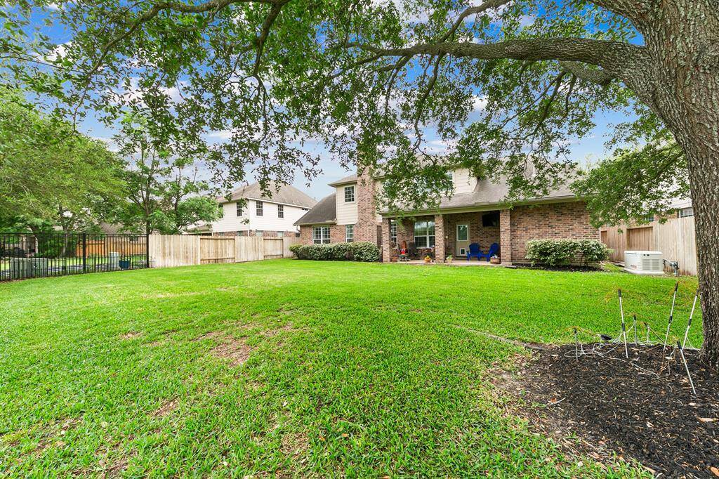 Large pool-sized backyard with space for a playscape, pets, entertaining and family fun.