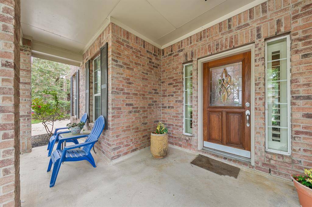 Gracious covered front porch makes a stunning first impression!