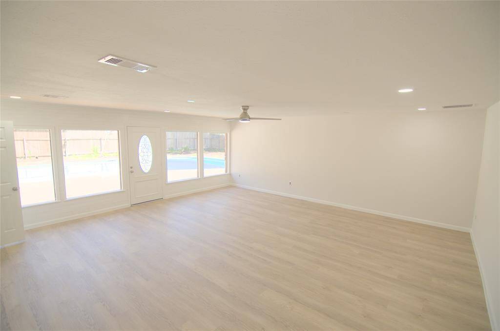 Large family room overlooking the swimming pool!