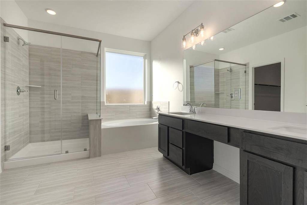 Each detail, from the elegant tile work to the modern vanities, has been carefully crafted