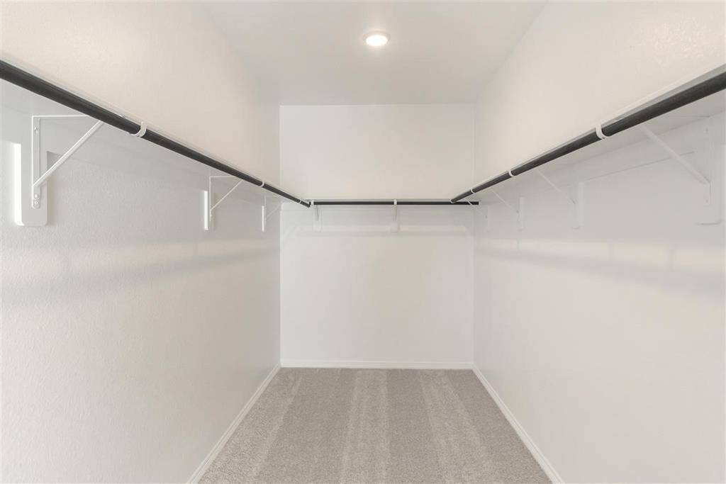 This closet is a perfect blank canvas to design a custom closet with ample hanging space,