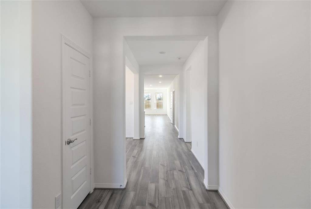 The first thing you’ll notice is the warm, natural light pouring in through large windows,