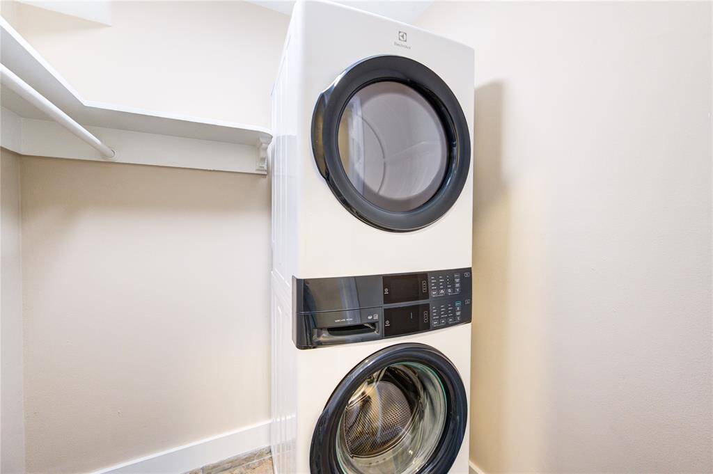 walk-in closet or pantry with full size new stackable washer & dryer