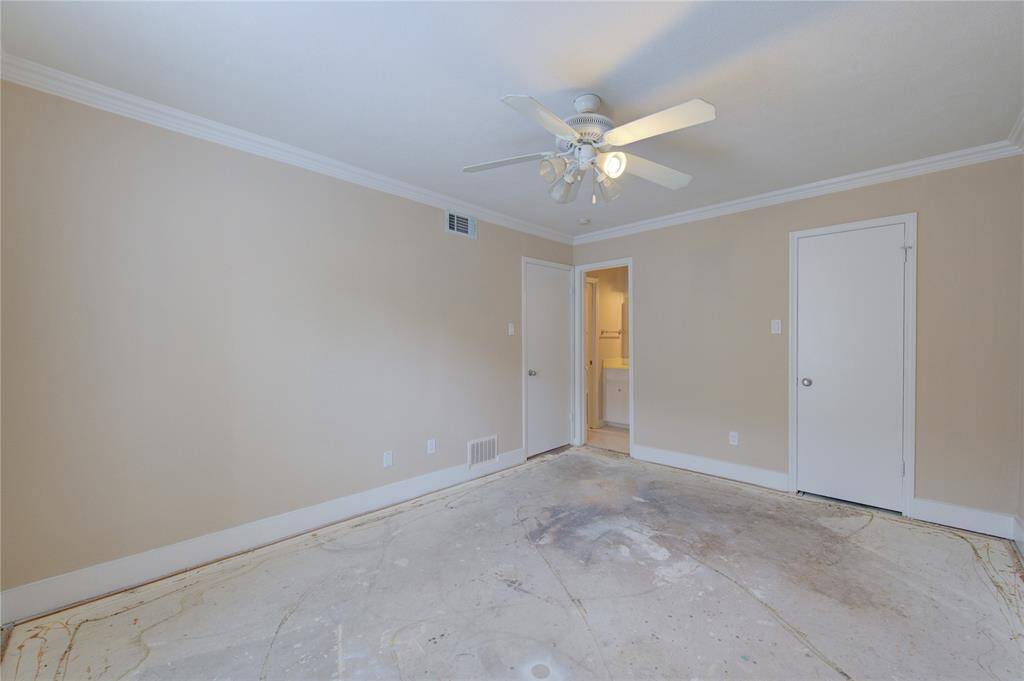 3rd view of primary bedroom with closet and ensuite bathroom