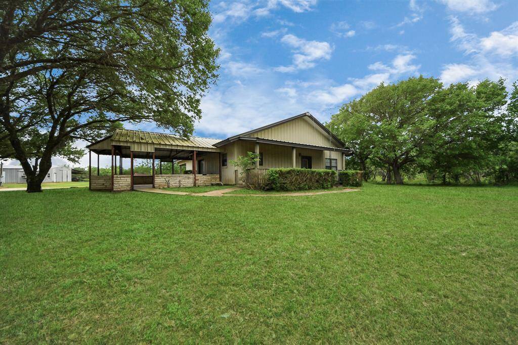 Charming single-story home with a spacious, well-maintained lawn and mature trees. Features a covered patio perfect for outdoor relaxation. Ideal for those seeking a peaceful, natural setting.
