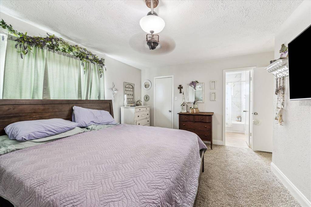 Primary suite offers more space and private walk-in closet.