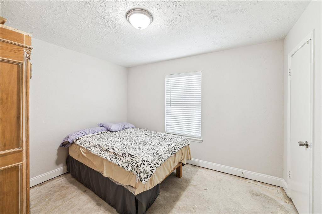 Other secondary bedroom with walk-in closet.  Flooring is being upgraded to wood like vinyl.
