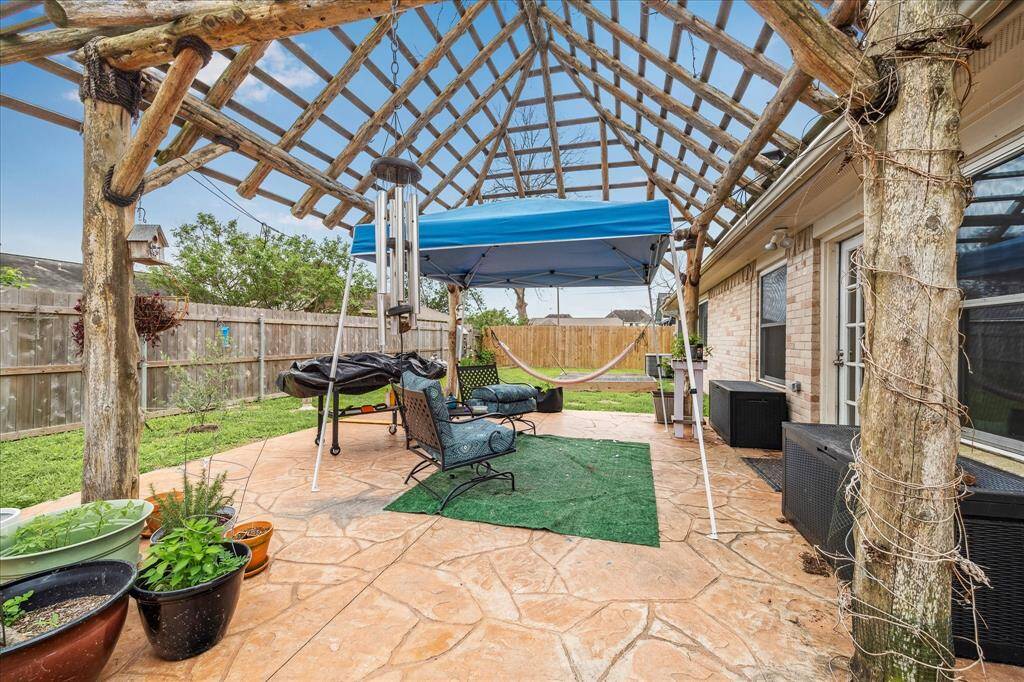 Fun and fabulous patio area with palapa structure ready for the covering of your choice.  Backyard fencing is newer.