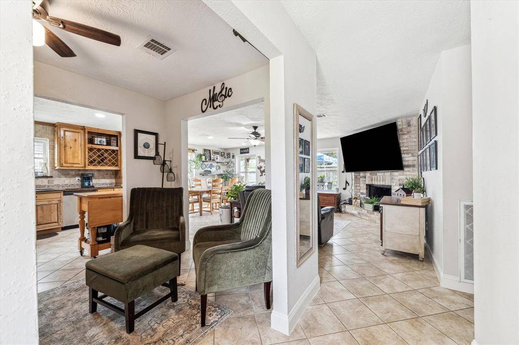 Welcome home! The entryway shows the open feel of the home with fantastic sight lines through the living and dining spaces.