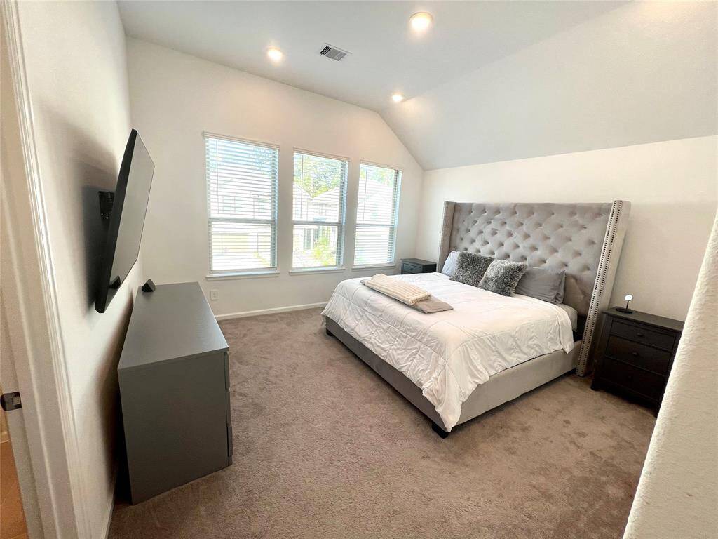 Primary bedroom is huge and has TONS of natural light.