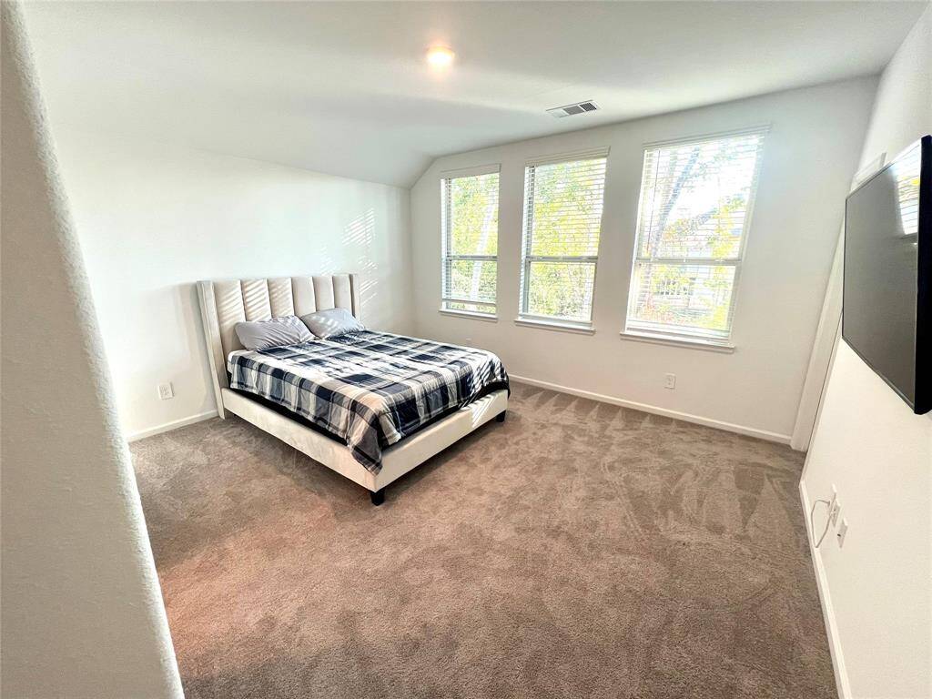 Large secondary bedroom with walk-in closet.