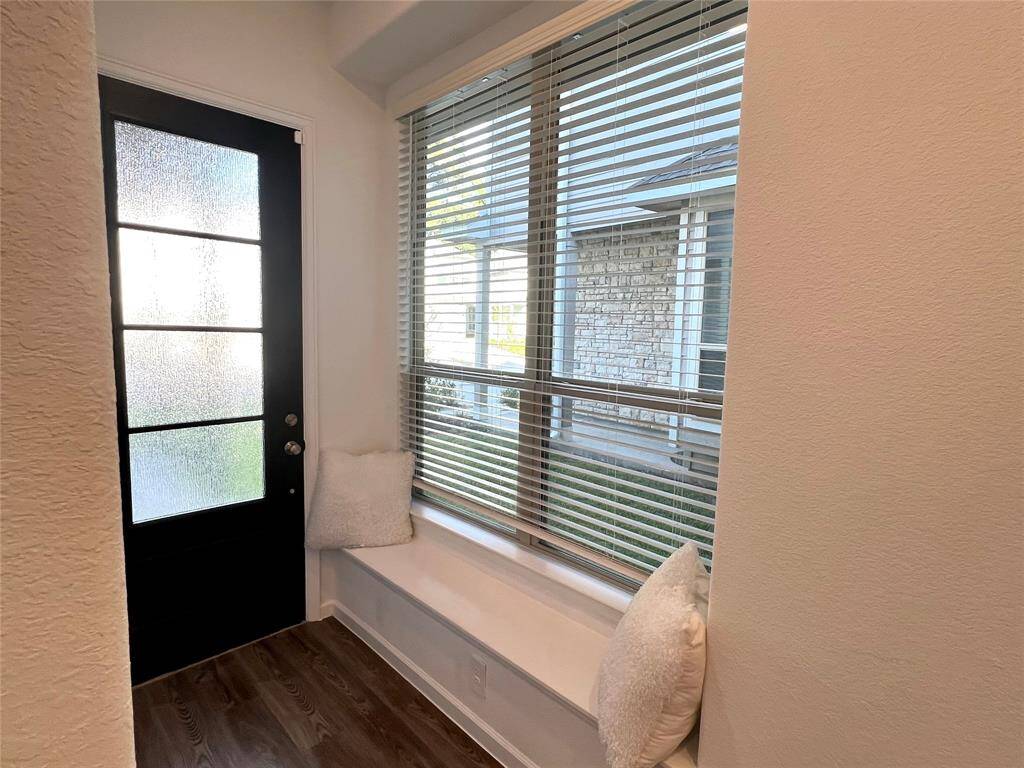 Enter the home and find neutral paint, luxury vinyl plank flooring, and cozy bench seating!