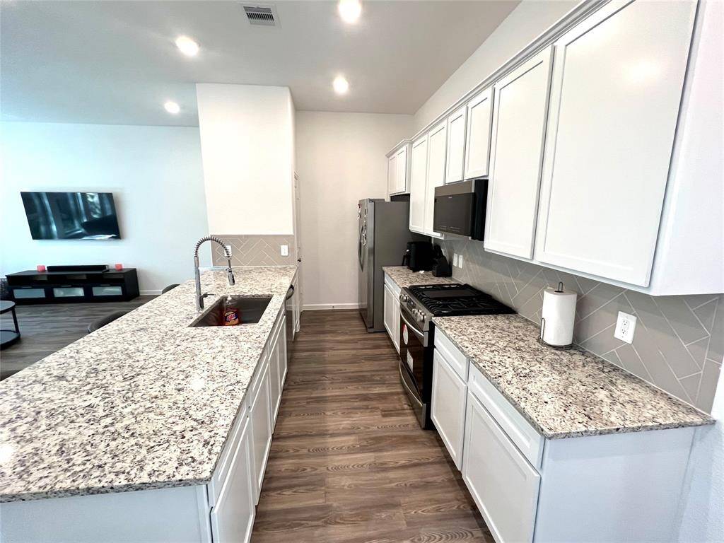 Plenty of cabinetry & storage in the kitchen.