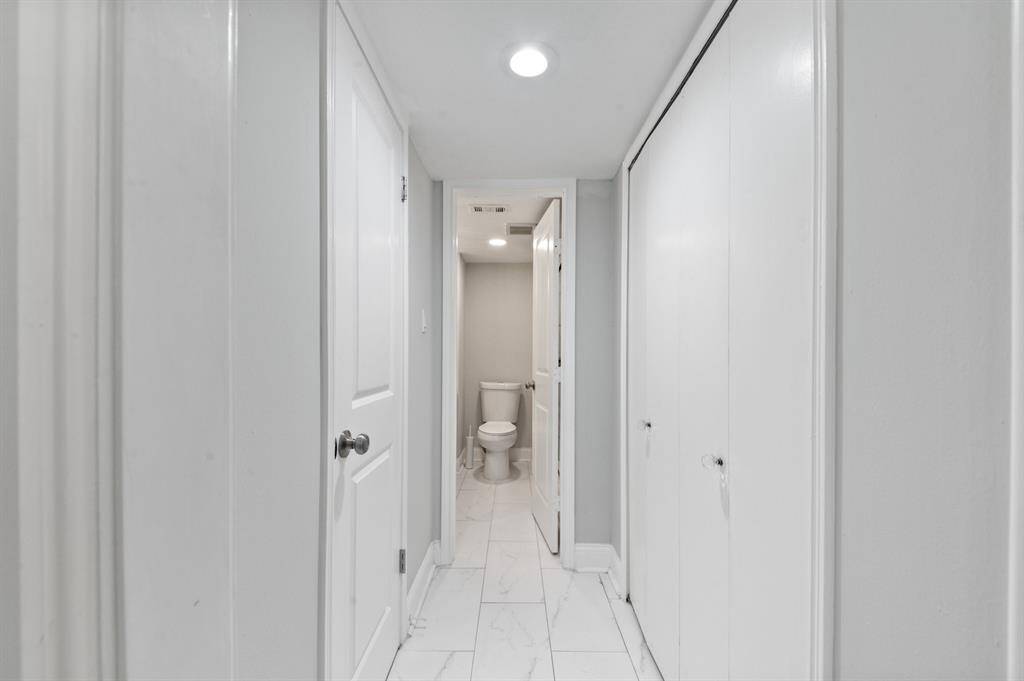 2 separate closets are featured in this hallway to the primary bathroom.
