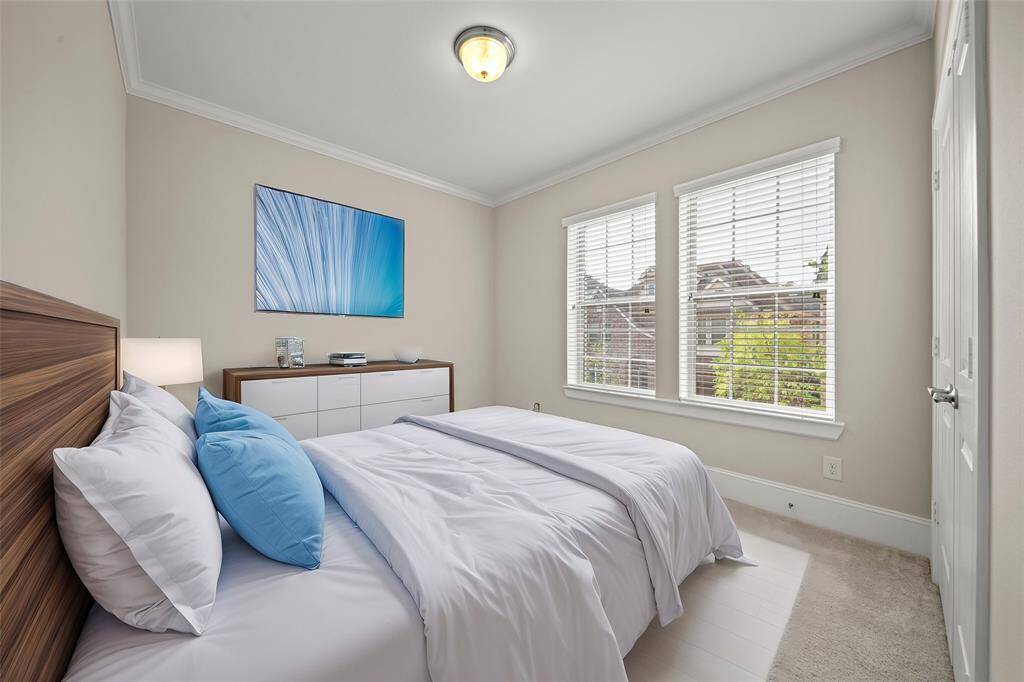 Comfortable secondary bedroom with plush carpet and ample lighting.(Virtual Staged)