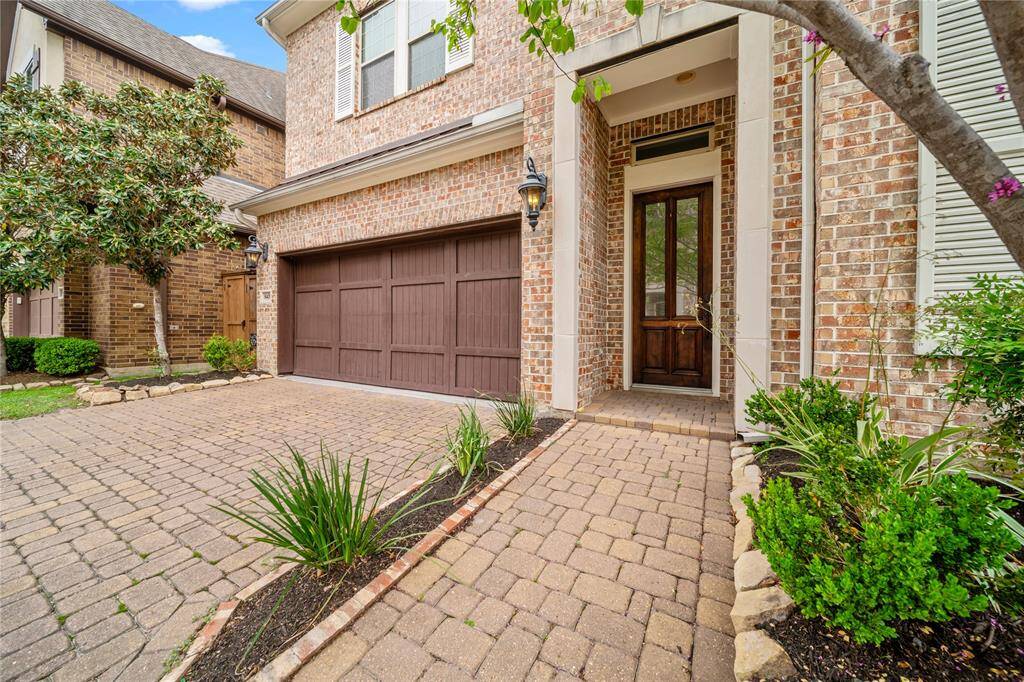 Wide view of the welcoming street lined with upscale homes and well-kept landscaping.