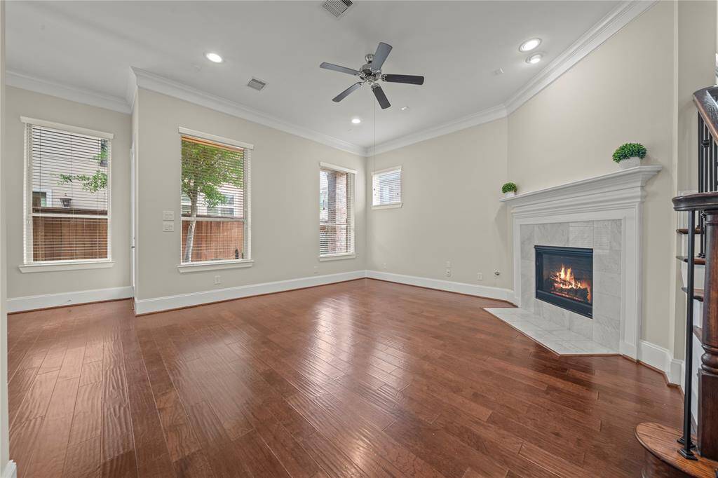 Inviting family room with fireplace and large windows overlooking the backyard.
