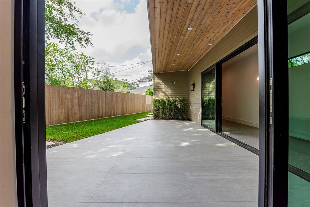 View of Patio connected at kitchen.  Had to make a plan to work on the off shape of the lot. I think it came out a beautiful solution.  10' easement can accommodate a small or lap pool if desired.