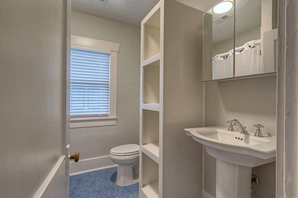 Full bath. Clean and crisp with storage