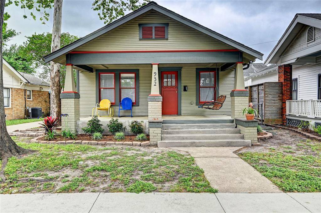 Front porch living! Mature trees grace the front.