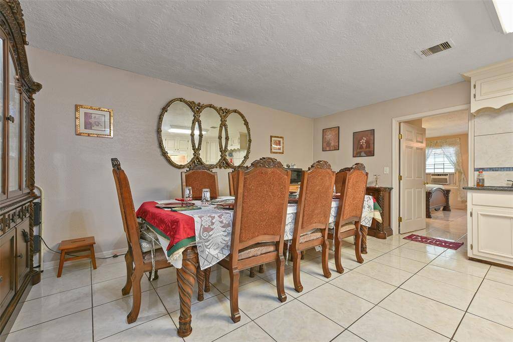 This area of the kitchen has been used as a formal dining space and can serve for ample space for any needs.