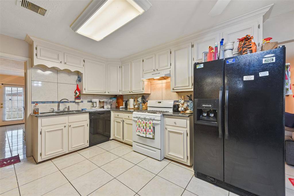 Large double-sink, dishwasher and gas stove make this chef's kitchen the heart of the home.