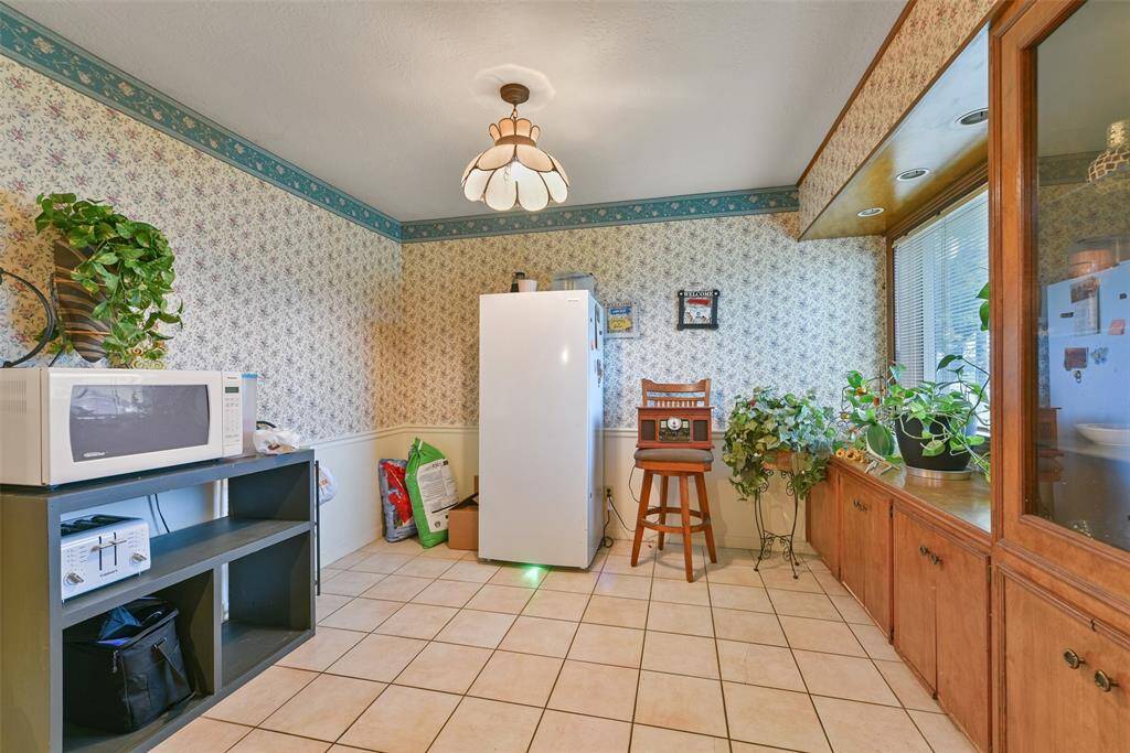 With tile flooring throughout and an abundance of natural light- make this room your own.