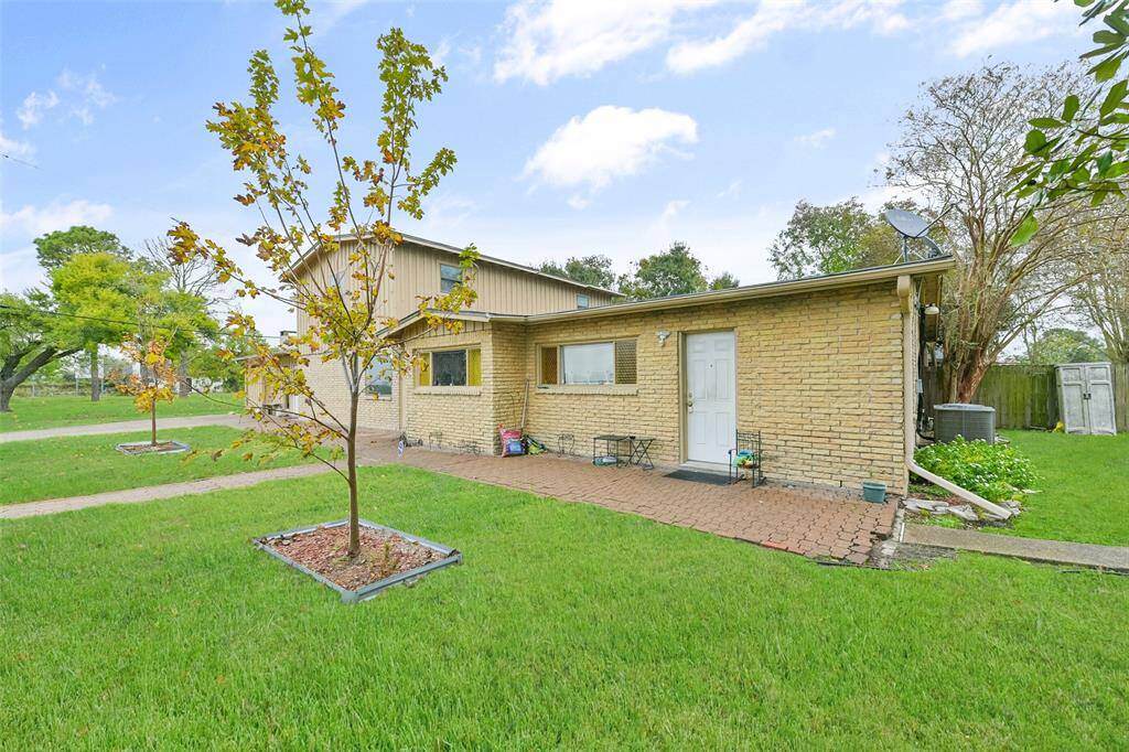Manicured lawn and landscaping adds to the charm of this duplex.