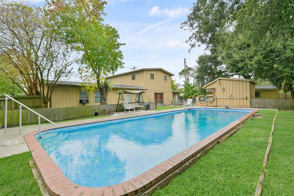 Take a dip in the pool and enjoy the outdoor living space of this charming duplex.