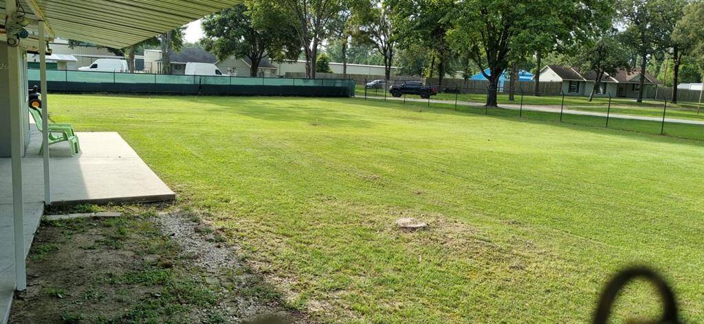 You’re greeted with a beautiful view of nearly an acre of lush green space.