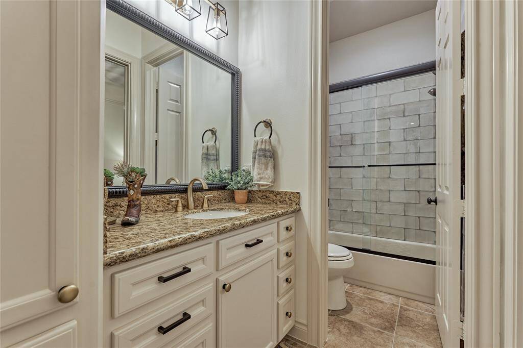 Guest ensuite #1 with tub/shower combo.