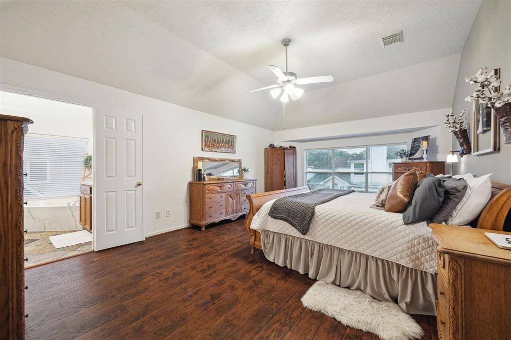 Primary retreat has a spa-like ensuite bathroom.