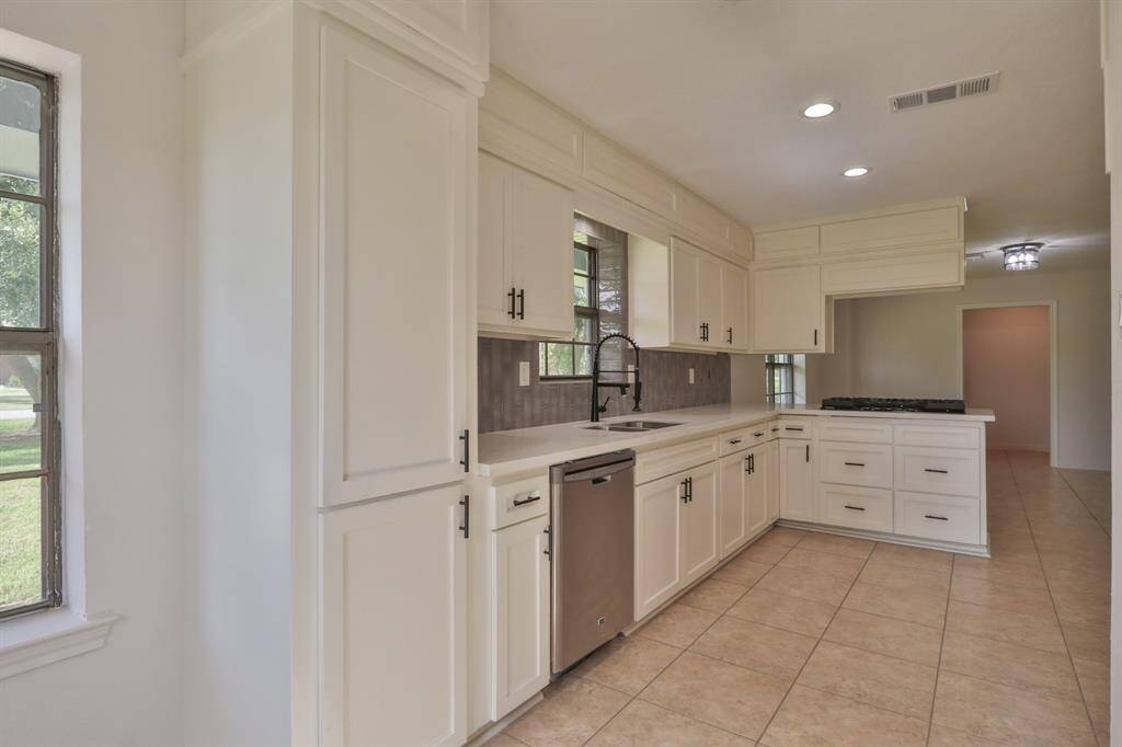 ANOTHER VIEW OF KITCHEN AND PANTRY CLOSET