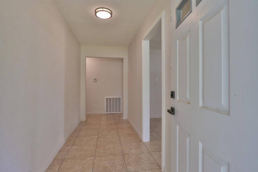 ENTRY AT FRONT DOOR INTO FOYER