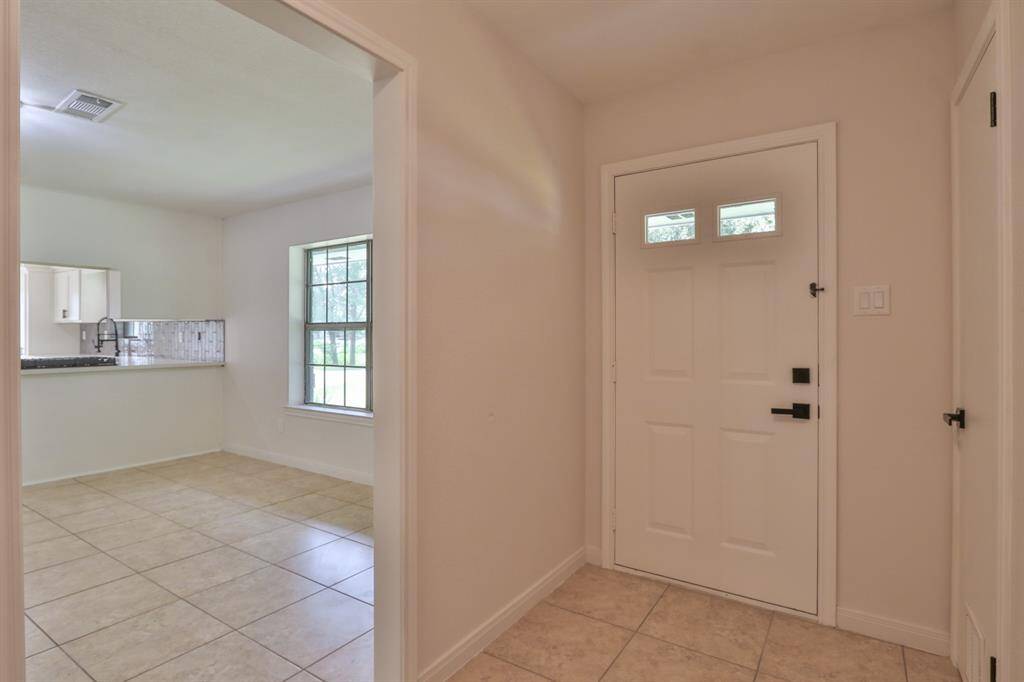 ENTRANCE VIEW AND DINING ROOM VIEW FROM FOYER