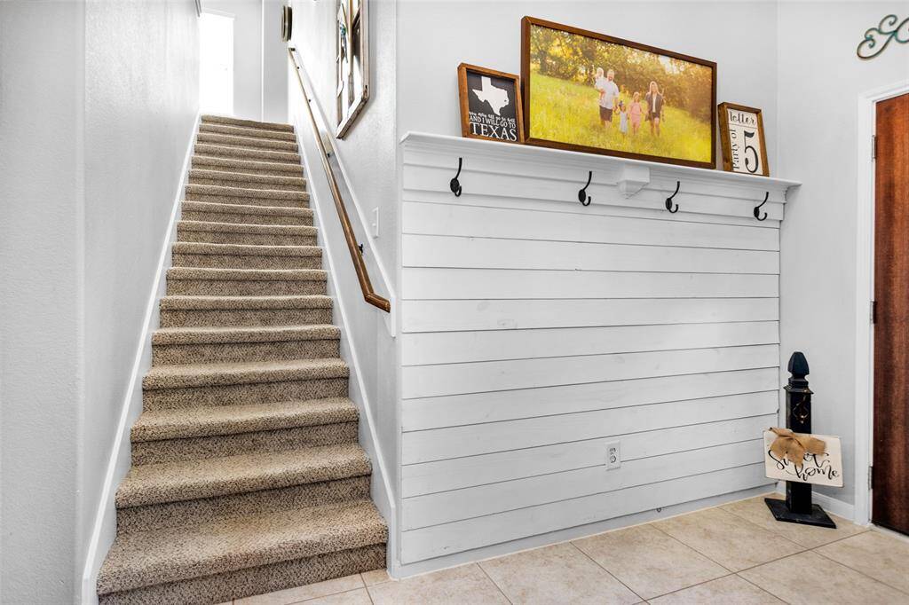 Foyer looking upstairs with Shiplap wall