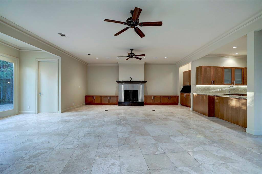 The huge family room is situated next to the kitchen created perfect flow into casual living.