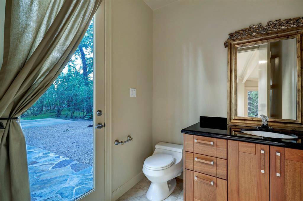 This the second powder bathroom / pool bath located next to the family room with direct access to the backyard.