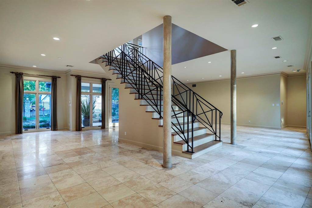 The Grand staircase leads to the second floor secondary bedrooms.