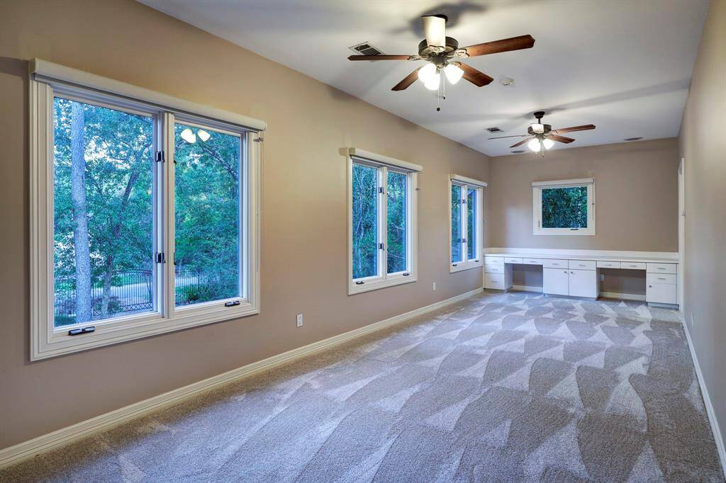 The second floor corridor with a built in-desk / work area. This creates an ideal work station next to the secondary bedrooms. All secondary bedrooms are upstairs on the second floor.
