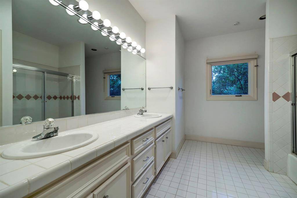Bedroom 3 & 4 have a very large shared bathroom dual sinks and shower/tub combo.