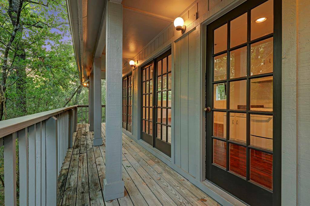 the second floor guest house balcony with great views of the yard.