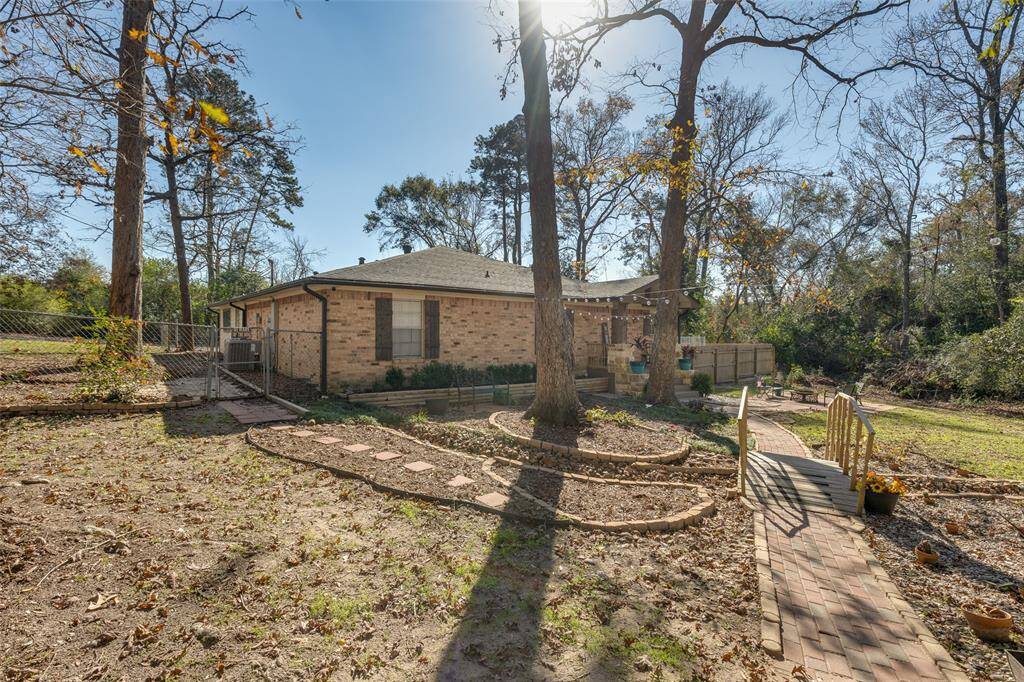 Beautiful, paved walkway leading to the front door. Pavers to the left lead to the gate into the backyard. Lots of privacy and space from neighbors.