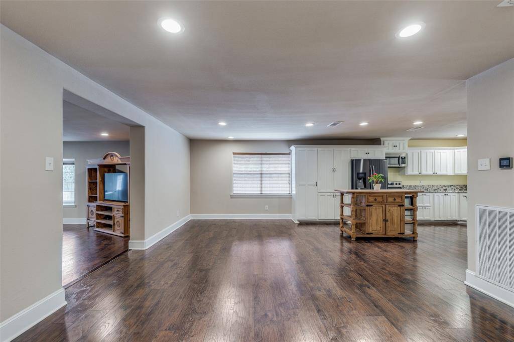 View from the larger dining area showing the location of the family room from the kitchen.