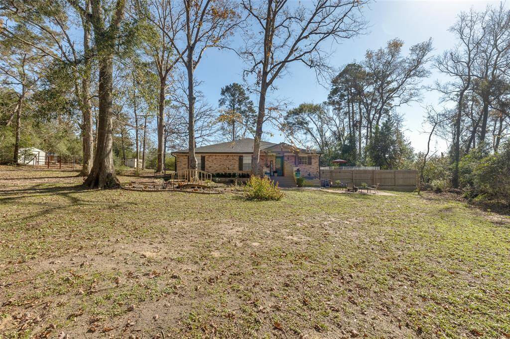 Front exterior view. Large front yard, home set far back from the street.