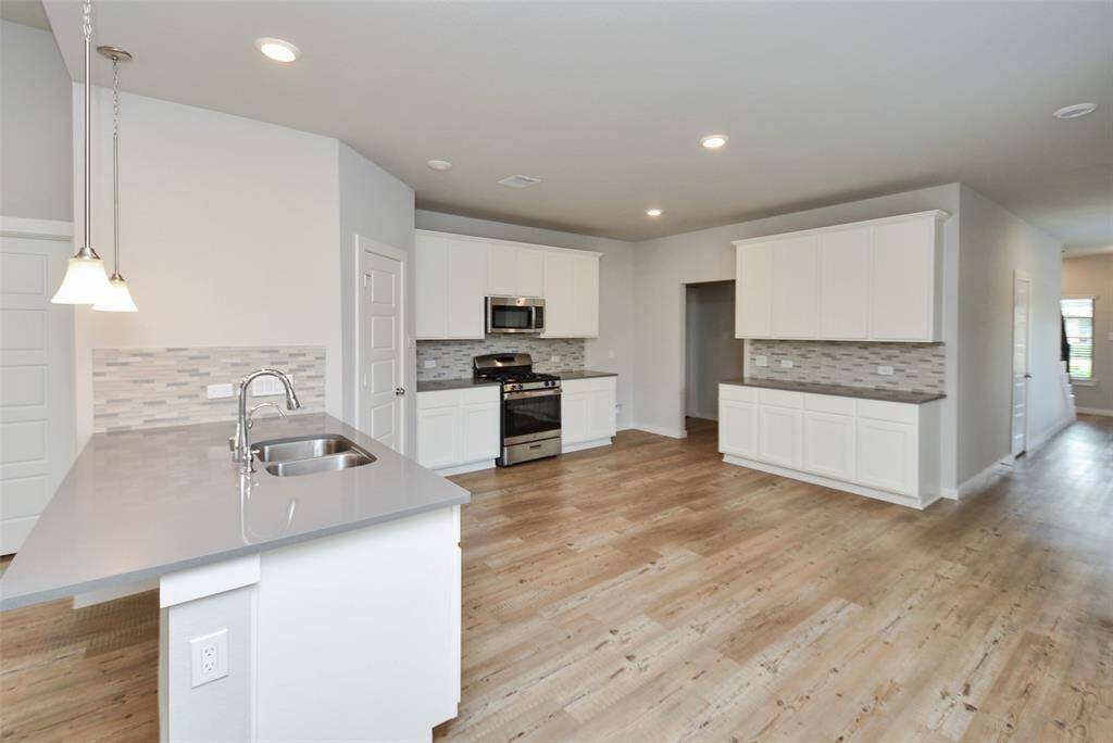 Modern kitchen in an open-plan space.