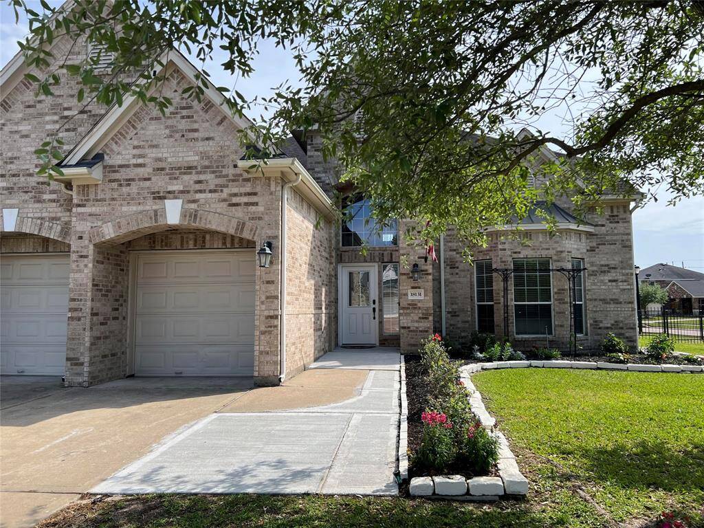 Meticulously maintained, inside and out (with new landscaping in front and backyards), this stately brick/wood, 2-story, single family, lakefront jewel, is located at 18131 Blues Point Drive, Cypress, TX, in the Sydney Harbour community. Pictured, left, are the artisan-like enclosed/recessed dual car attached garages, atop a comfortably, approachable driveway. Inside, are 5/6 bedrooms, 3-1/2 baths, all sitting on a generous 8,986 square-foot lot with 3,973 square-feet of interior space.
